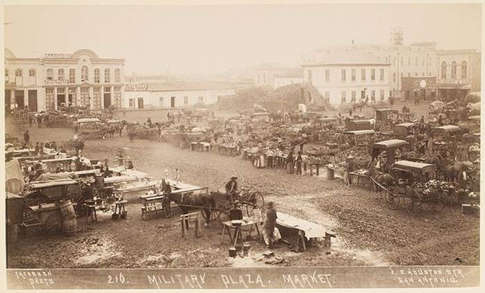 A group of people in a military market

Description automatically generated